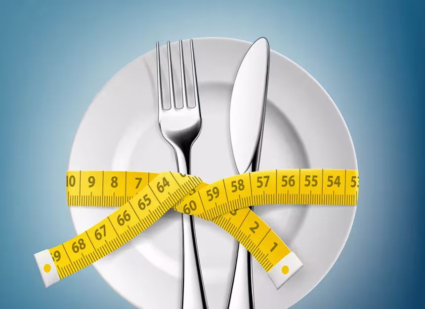 Plate and utenstils with measuring tape wrapped around - Habits To Start Your Weight Loss Journey