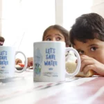 School children with cups advocating water conservation through 'Save Water' messages.