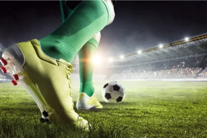 image of football player on the field about to kick a ball