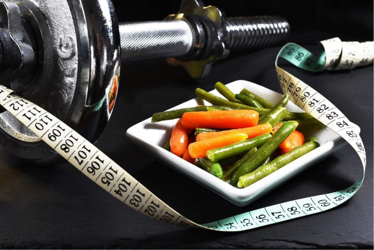5 Popular Myths About Weight Loss - Debunked 2 Plate of vegetables next to weights
