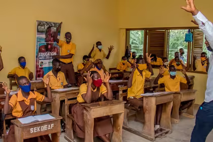 Children in Ghana learning inside a classroom, with the support of ANOPA, QNET and RYTHM Foundation