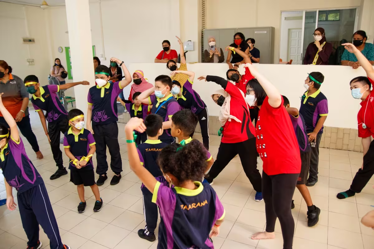 #Betheimpact: How Qnet Has Effected Sustainable Change And Built Communities 4 Taarana staff going to a school to teach kids dancing