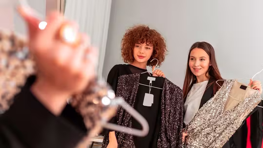 Join The Sustainable Style Revolution With The Award-Winning Bernhard H. Mayer Omni 2 women showing dresses on a clothes hanger omni watch