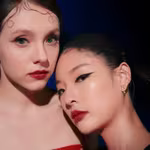 Two models posing with Bernhard H Mayer Insignia Collection