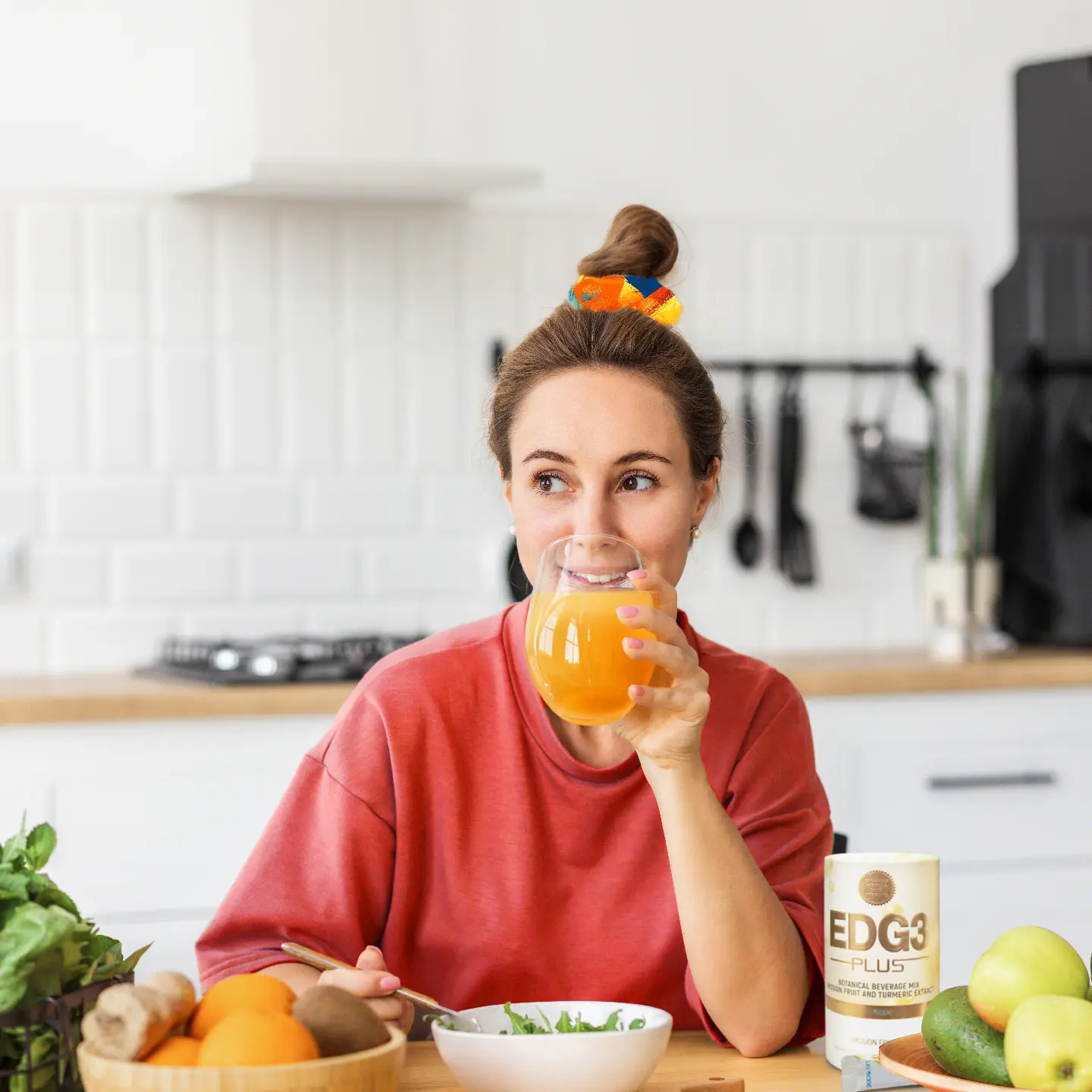 Woman drinking nutritious drink and eating salad