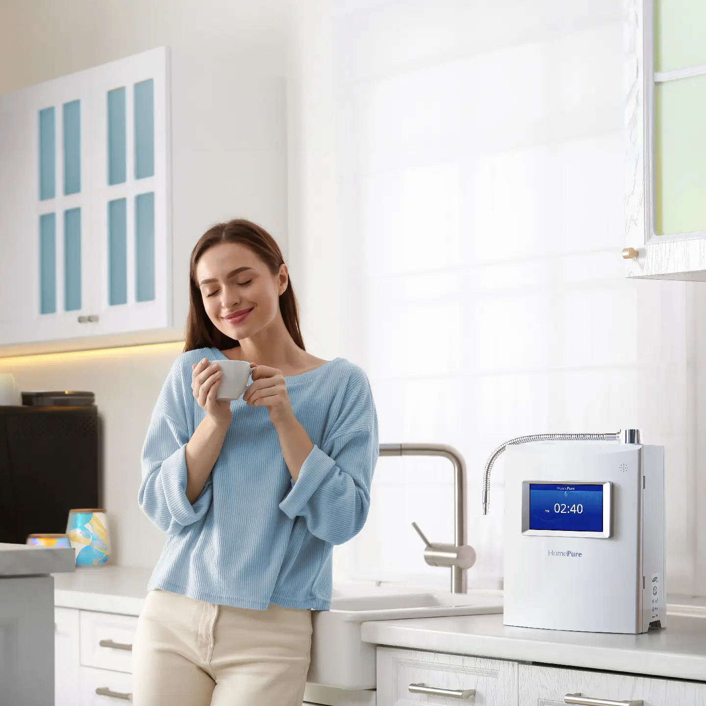Woman drinking a glass of water from HomePure Viva