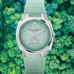 Green OMNI watch displayed above a top view image of trees