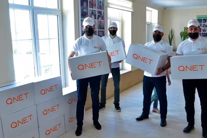 Representatives from QNET, through RYTHM Foundation, donate goods for Ramadan 2021