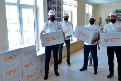 Representatives from QNET, through RYTHM Foundation, donate goods for Ramadan 2021