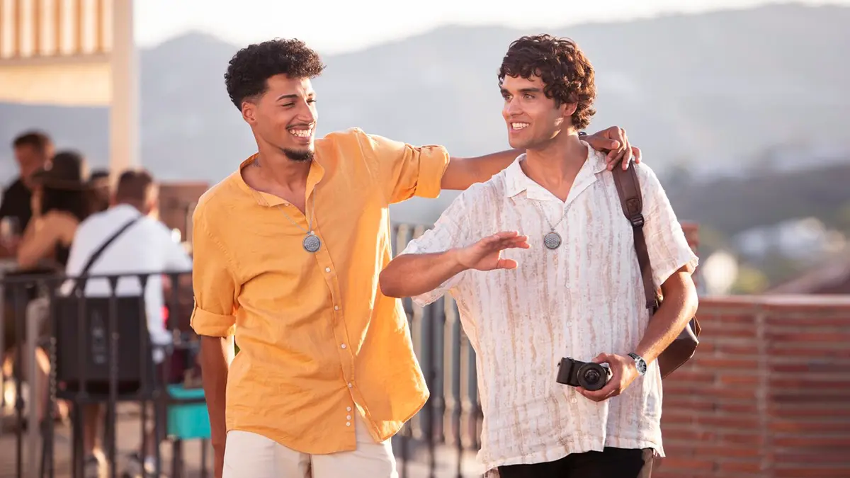Two guys on a holiday wearing Amezcua Chi Pendant 4