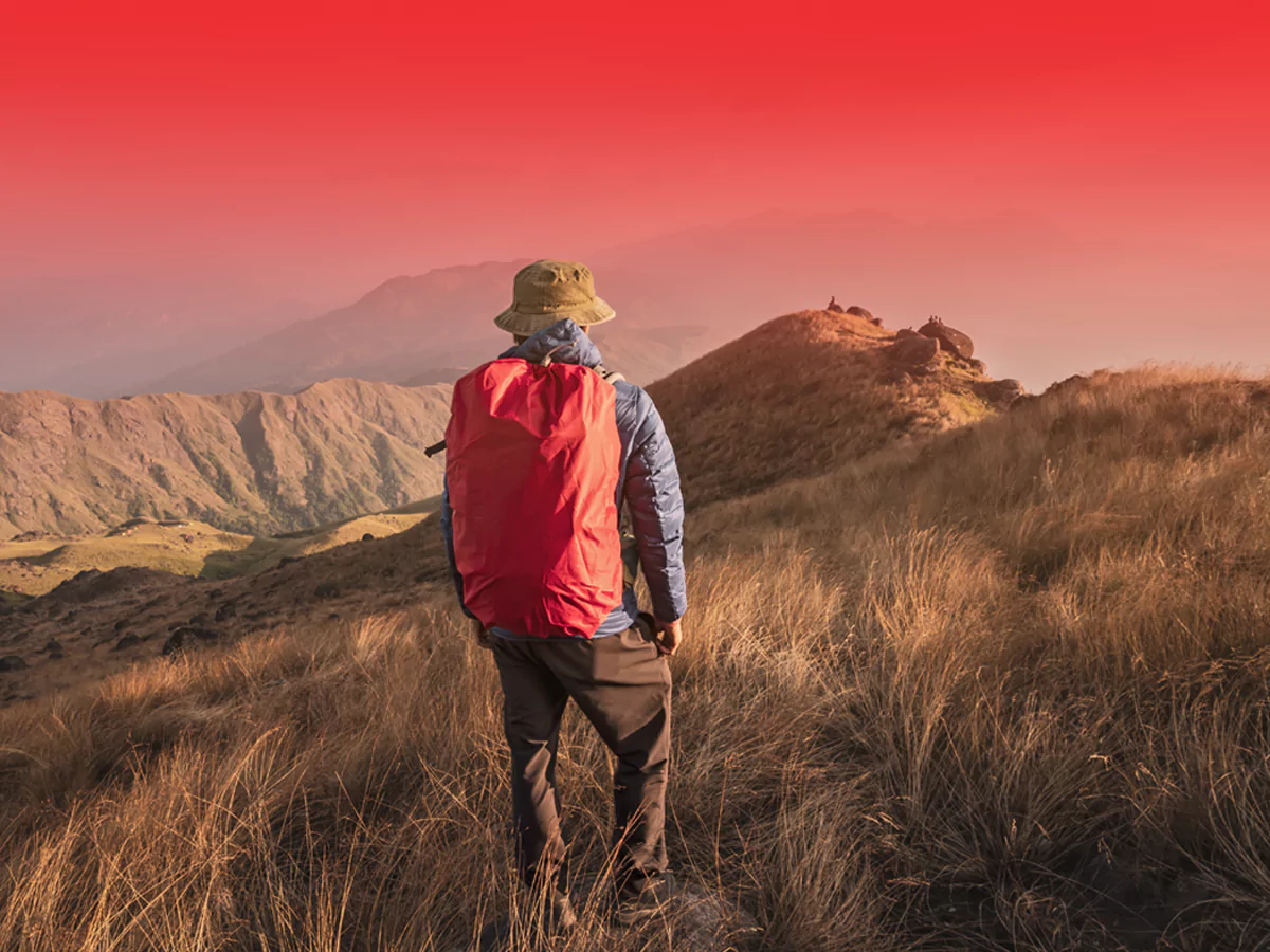 man walking on moutain qvi tripsavr