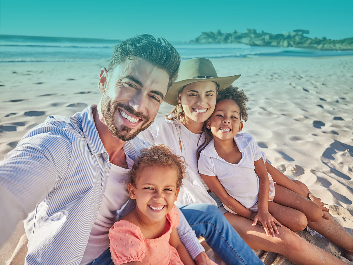 Family at the beach qvi vacay