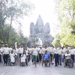 Participants in the march for a mine-free Cambodia sponsored by QNET, in front of Angkor Wat