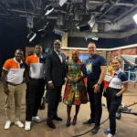 QNET in Ghana: Trevor Kuna, Biram Fall, and Vicky Ras pose with GTV presenter Maltiti Sayida Sadick