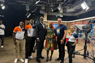QNET in Ghana: Trevor Kuna, Biram Fall, and Vicky Ras pose with GTV presenter Maltiti Sayida Sadick