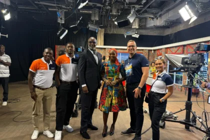 QNET in Ghana: Trevor Kuna, Biram Fall, and Vicky Ras pose with GTV presenter Maltiti Sayida Sadick