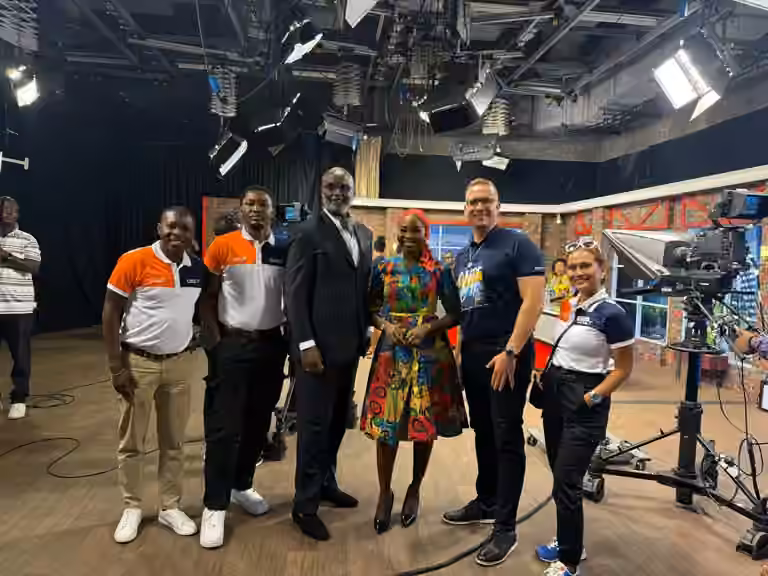 QNET in Ghana: Trevor Kuna, Biram Fall, and Vicky Ras pose with GTV presenter Maltiti Sayida Sadick