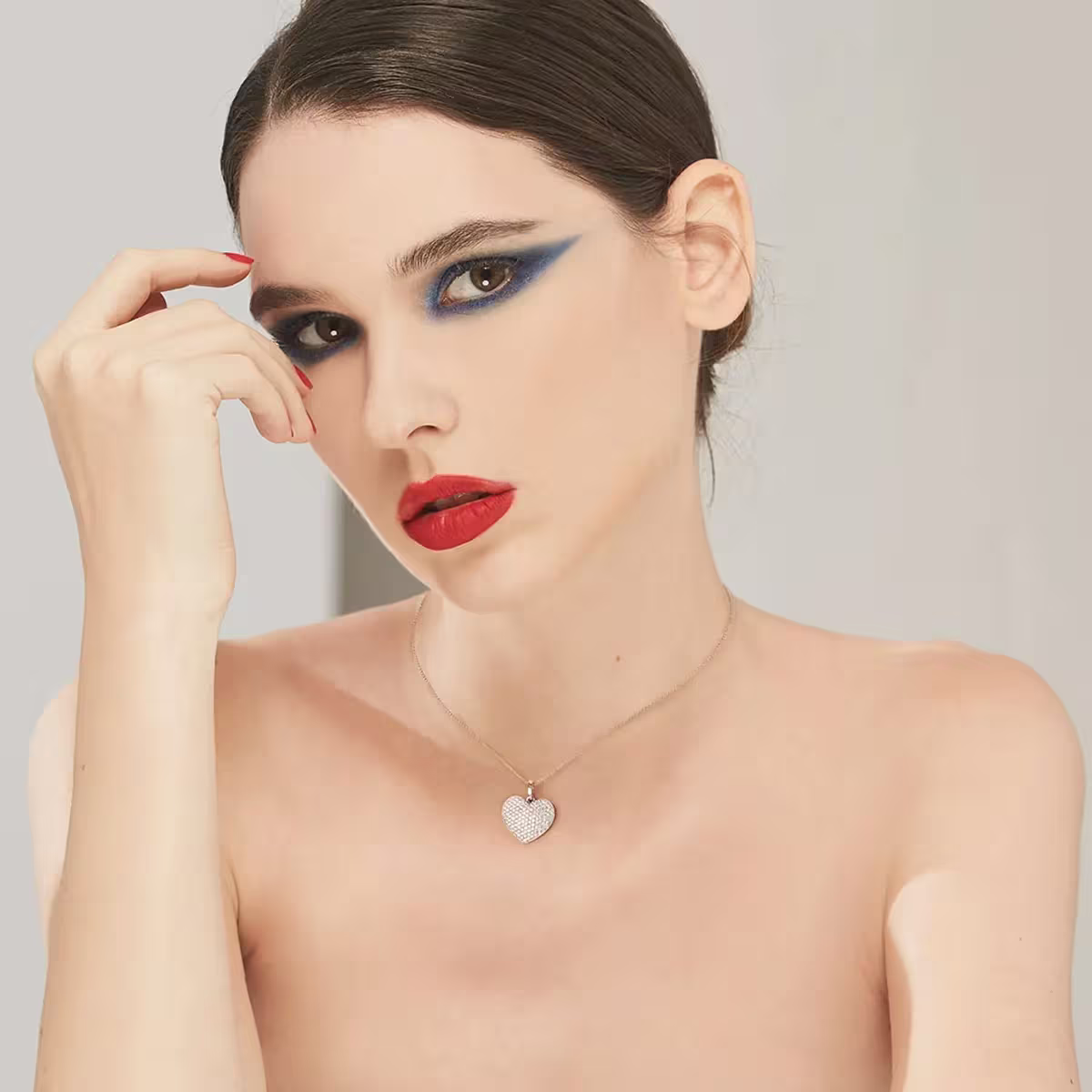 Dazzling Choice: What Makes A Good Diamond? 2 Woman wearing Bernhard H. Mayer Freya Pendant with 1.00 ct diamonds, H/SI