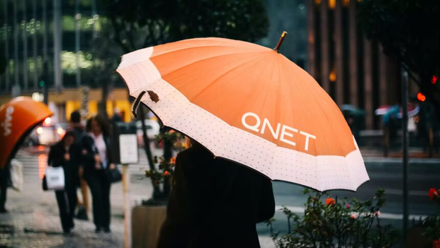 Rainy Season Tips by QNET - girl with an orange umbrella