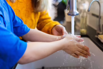 Why home water quality matters | Boy washing hands